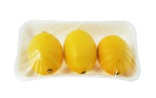 Tres limones en envase de vacío — Foto de Stock