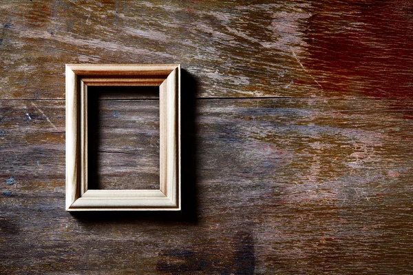 Empty frame on wooden background — Stock Photo, Image