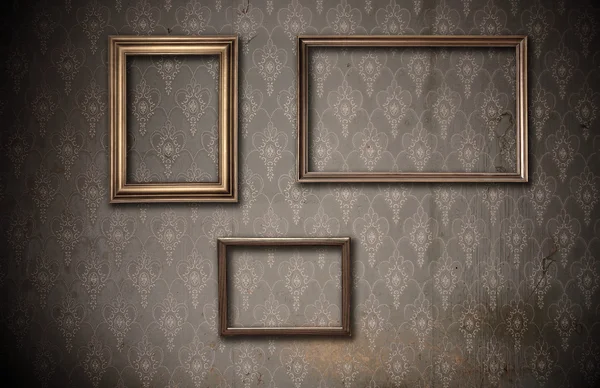 Picture-frames on dirty wall — Stock Photo, Image