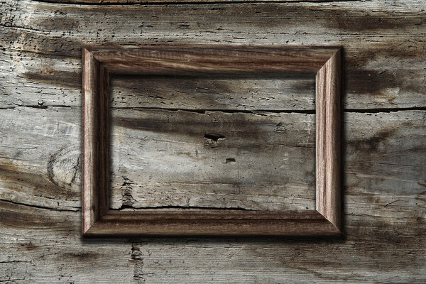 Blank frame on old wooden background