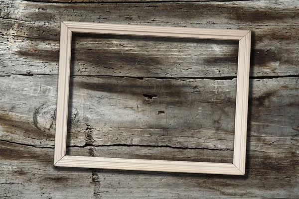 Marco sobre fondo de madera —  Fotos de Stock