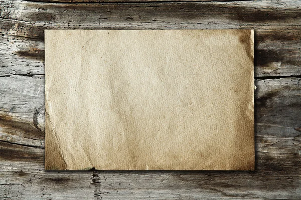 Vintage paper on wood texture — Stock Photo, Image