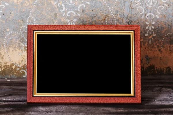 Photo-frame on old table — Stock Photo, Image