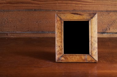 Photo frame on table clipart