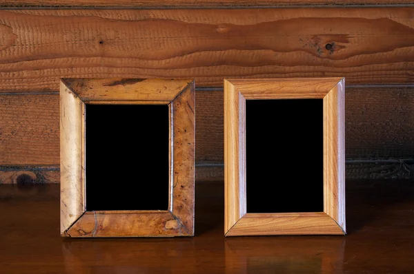 stock image Old photo frames on table