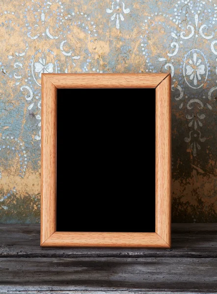 Photo-frame on old table — Stock Photo, Image