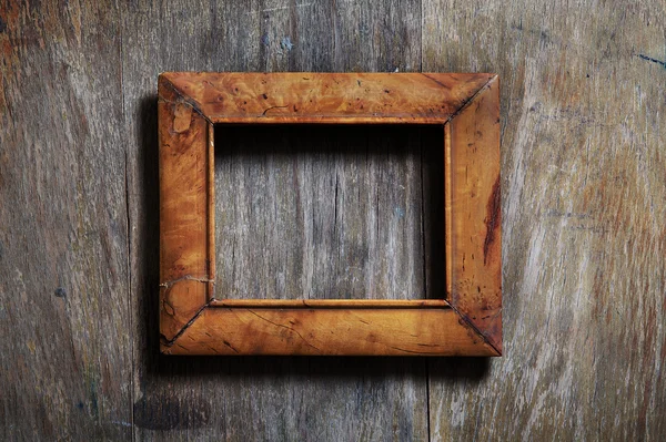 Empty frame on wooden background — Stock Photo, Image