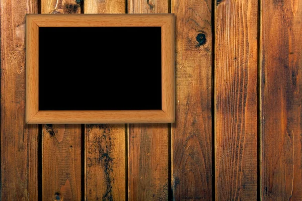 Винтажная фоторамка на деревянной стене — стоковое фото