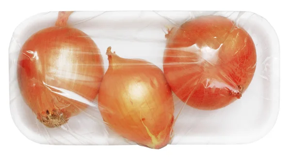 Three onions in vacuum pack — Stock Photo, Image