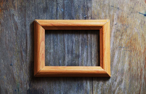Cornice vuota su sfondo di legno — Foto Stock