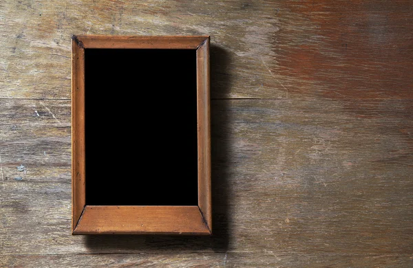 Prázdný rám na dřevěném pozadí — Stock fotografie
