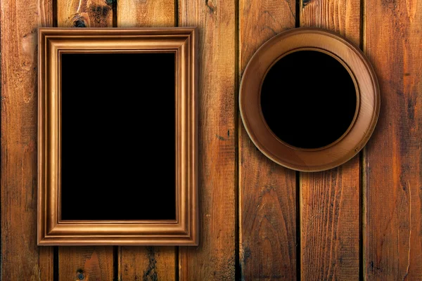 Vintage frames on wooden background — Stock Photo, Image