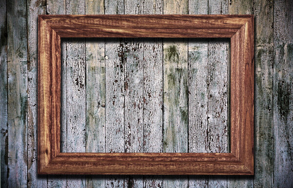 Blank photoframe on old wooden background