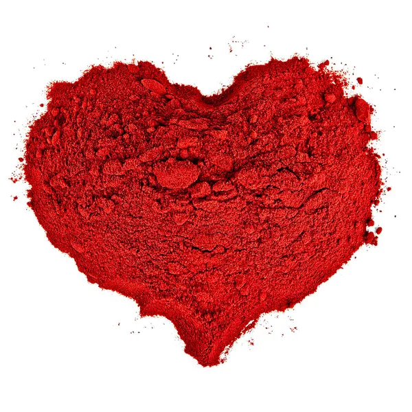 Forma do coração feita de areia vermelha fina . Fotos De Bancos De Imagens Sem Royalties