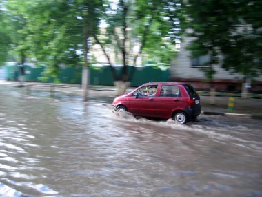 Red car in a water clipart