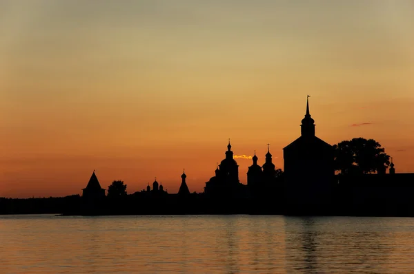 Silhouette of monastery at sunset. Stock Image