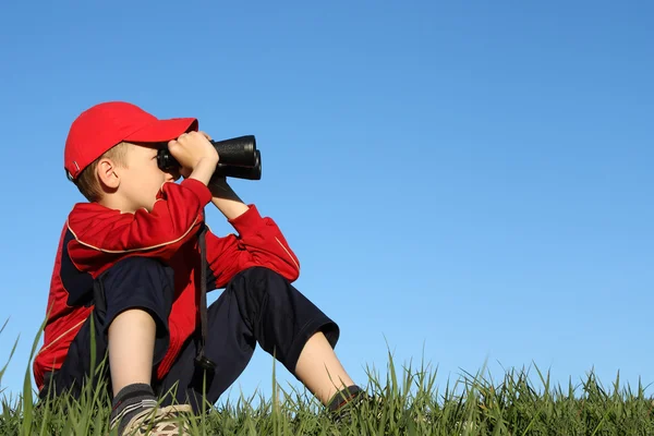 stock image Boy looks into binoculars