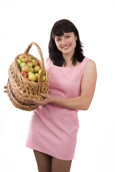 Flicka med en korg full av frukt — Stockfoto