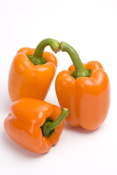 Three orange sweet peppers. — Stock Photo, Image