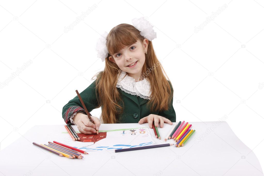 Schoolgirl is drawing in pencil.