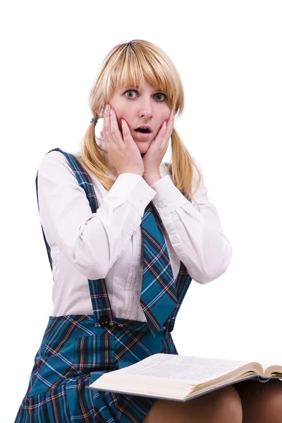 Schoolmeisje is geschokt door examens Stockfoto