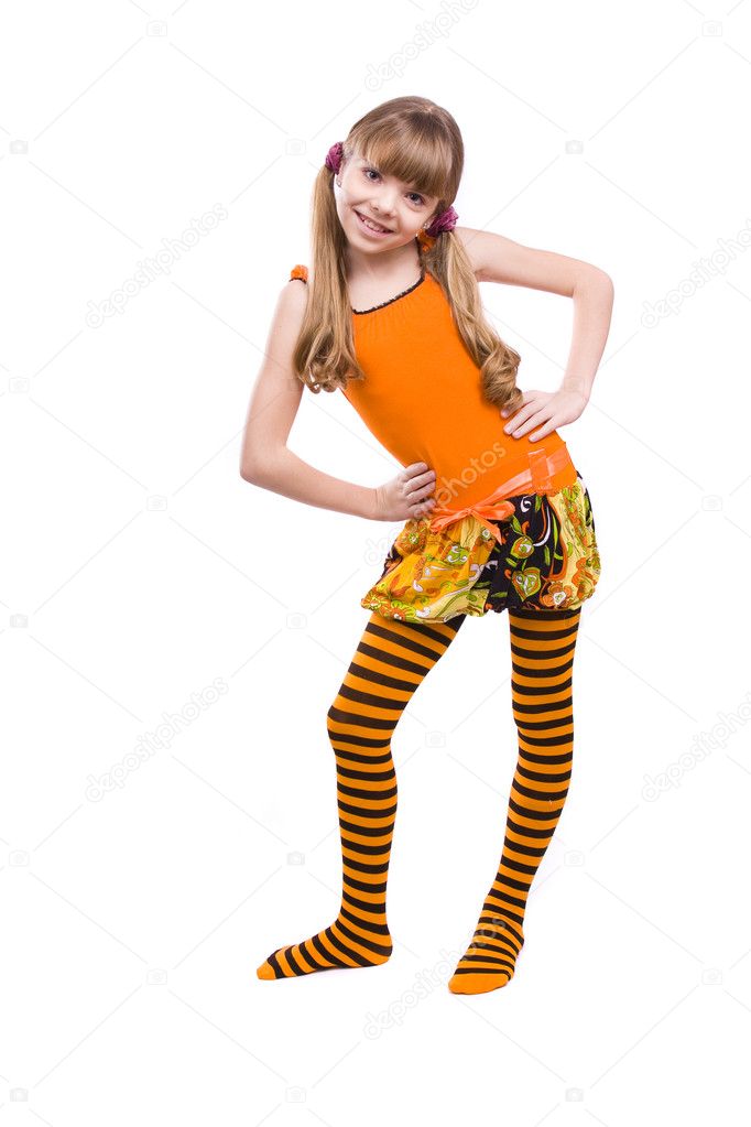 Little girl in orange dress is standing