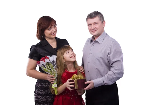 Father giving gift daughter and mother Stock Photo