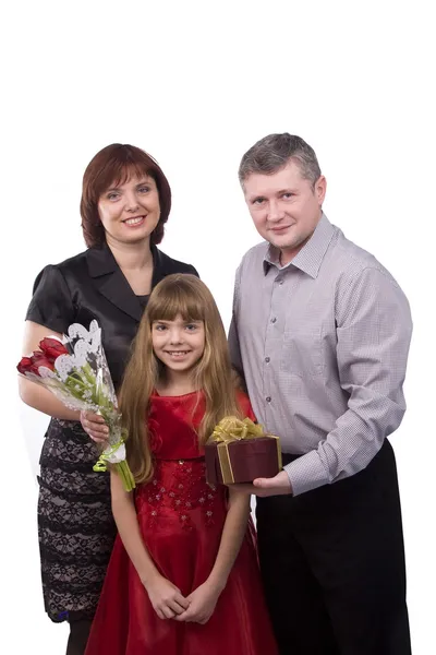 Father giving gift daughter and mother Stock Photo