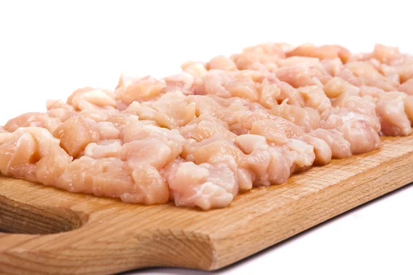 Minced chicken meat on wooden board Stock Photo