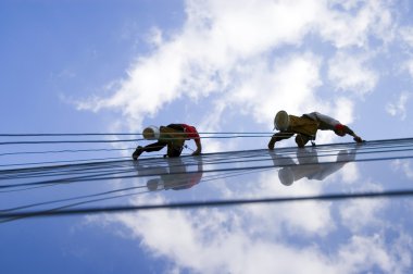 Two workers washing windows clipart