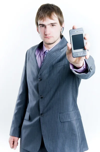 Empresário mostrando telefone — Fotografia de Stock