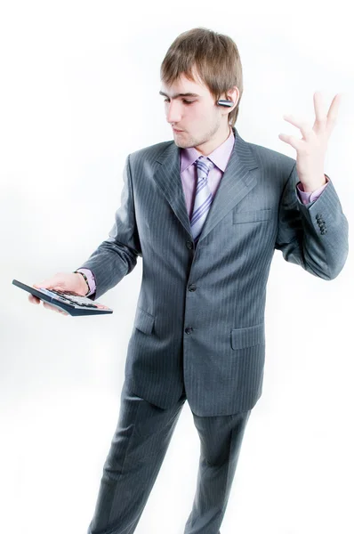 Empresário perturbado com calculadora — Fotografia de Stock