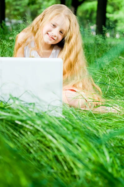 stock image Smiling little girl with laptop