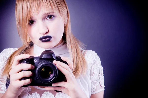 Young girl with camera — Stock Photo, Image