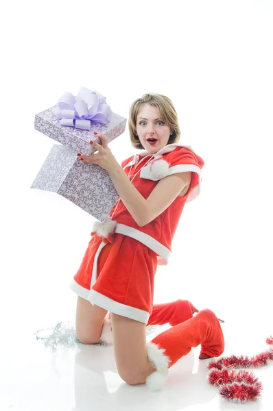 Young girl in Santa Claus clothes with g — Stock Photo, Image