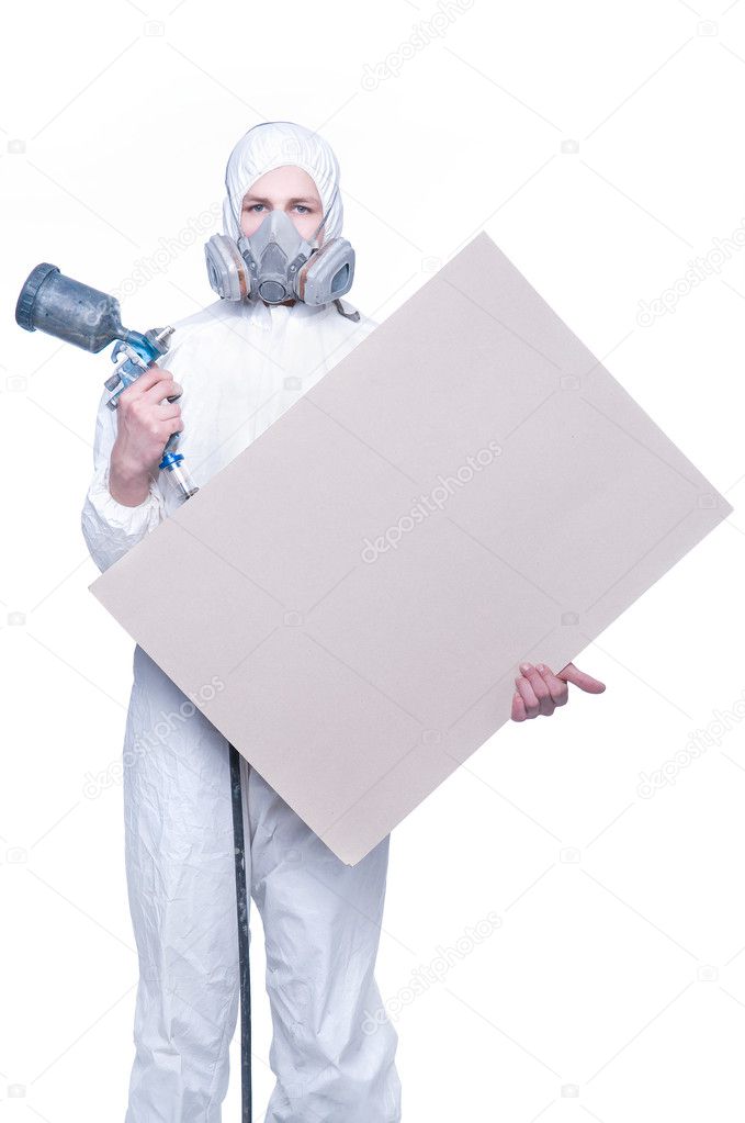 Worker with airbrush gun and blank