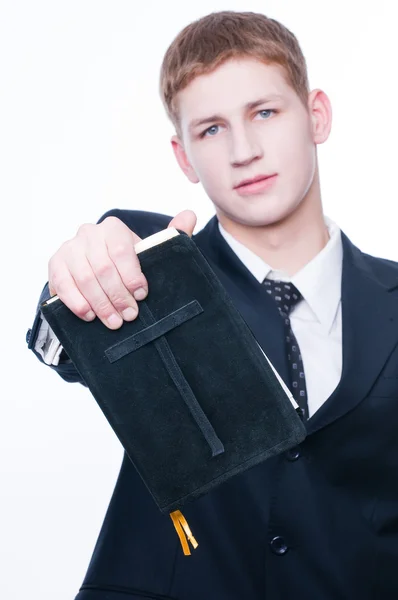 Young man showing Bible — Stock Photo, Image
