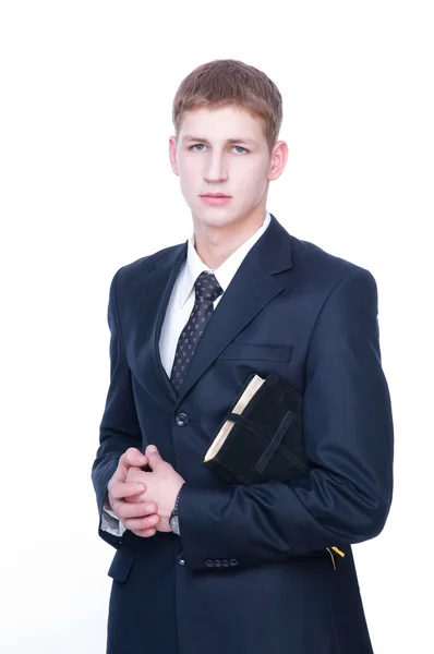 Serious young man with Bible — Stock Photo, Image