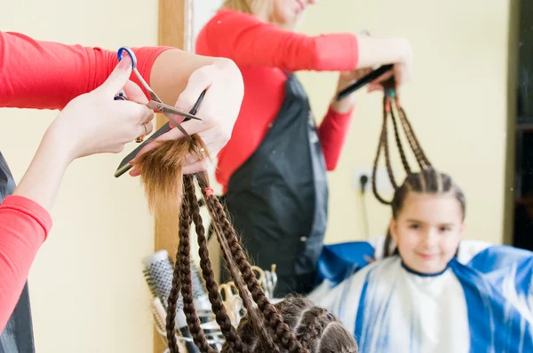 Cute girl in hairdresser salon Stock Picture