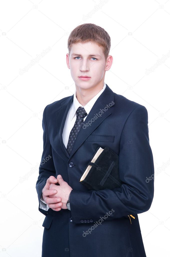 Serious young man with Bible