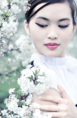 Young woman with cherry flowers clipart