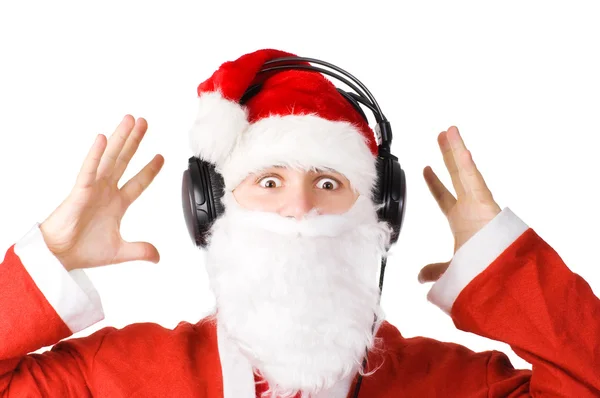 Santa lyssnar en musik — Stockfoto