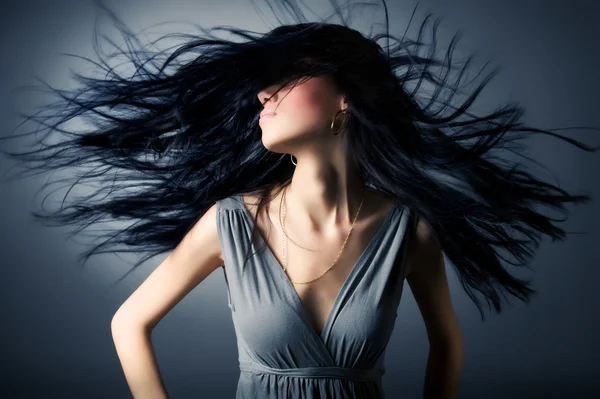 Женщина с трепещущими волосами Стоковое Фото