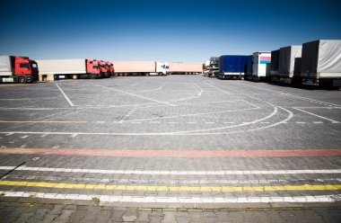 Trucks on a parking clipart