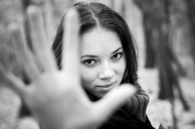 Woman stretching hand to the camera clipart