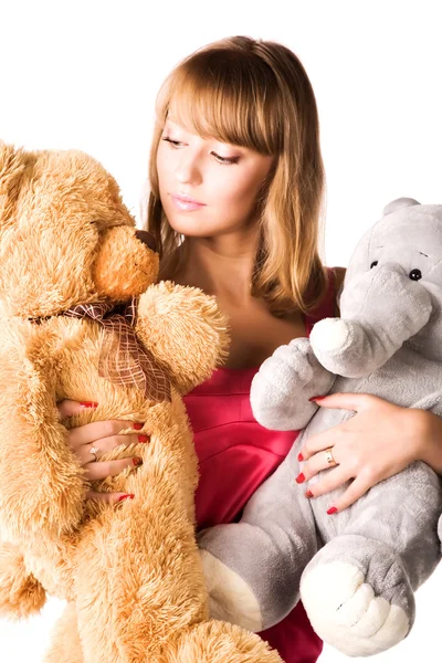 Young woman with toys — Stock Photo, Image