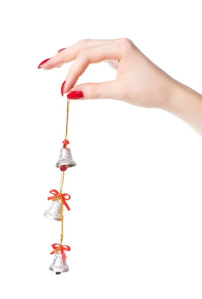 Ręka kobiety z małych dzwony — Zdjęcie stockowe