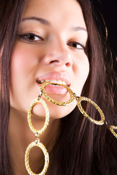 Young woman with colden chain