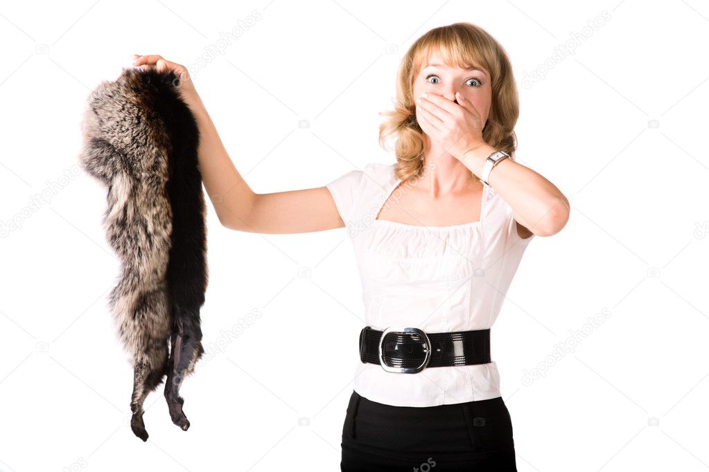 Shocked woman holding fur skin