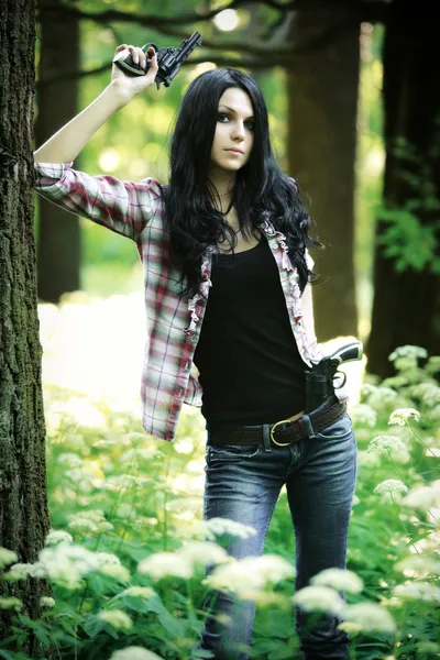 Young woman with guns — Stock Photo, Image